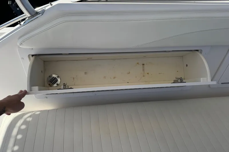 Slide: The Image of Open storage compartment on 2001 Pro-Line 30 Express boat interior. - 21