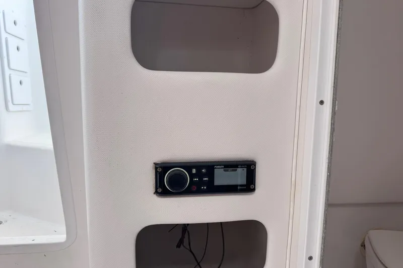 Slide: The Image of 2001 Pro-Line 30 Express boat interior with Fusion stereo system installed. - 31