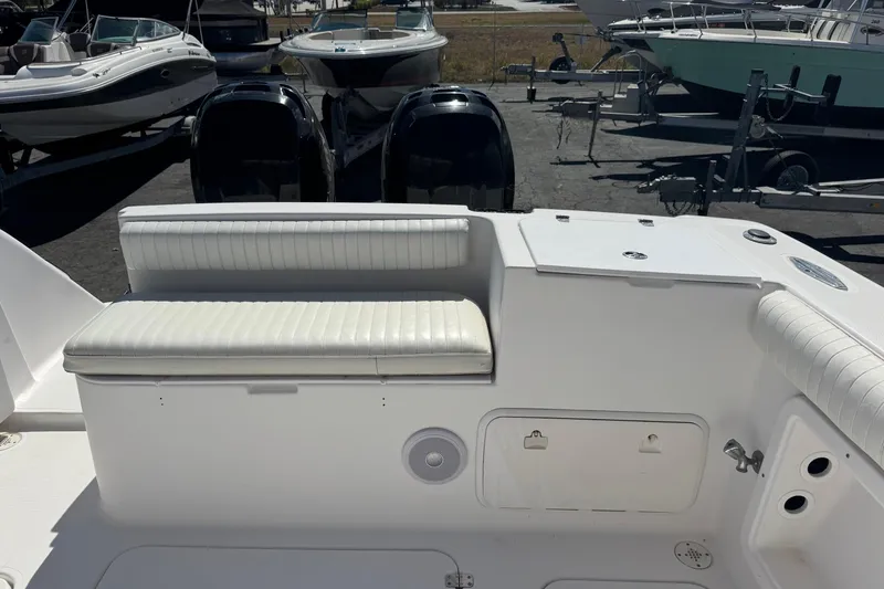 Slide: The Image of 2001 Pro-Line 30 Express boat interior with seating and storage compartments. - 35