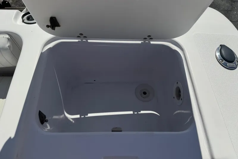 Slide: The Image of Open storage compartment on a 2001 Pro-Line 30 Express boat. - 38
