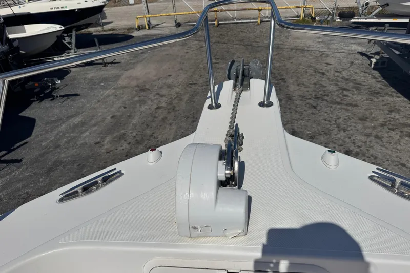 Slide: The Image of Bow view of 2001 Pro-Line 30 Express boat with anchor chain and railings. - 42
