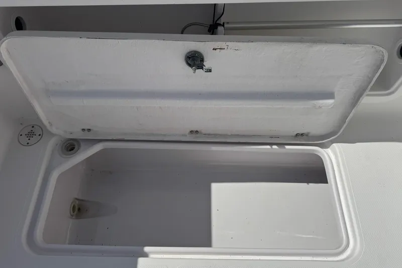 Slide: The Image of Open storage compartment on a 2001 Pro-Line 30 Express boat. - 50