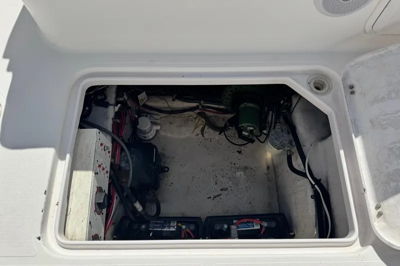 Slide: The Image of Open engine compartment of 2001 Pro-Line 30 Express boat, showing wiring and components. - 51