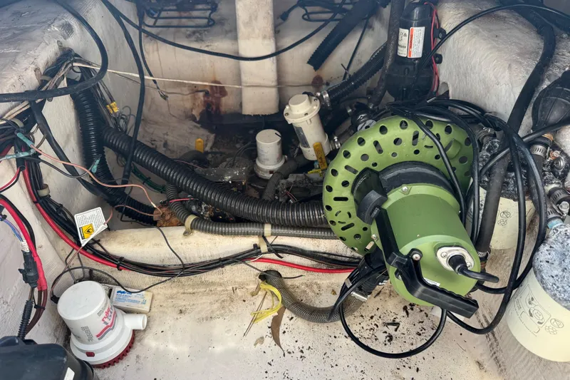 Slide: The Image of Engine compartment of a 2001 Pro-Line 30 Express boat with wiring and components. - 53