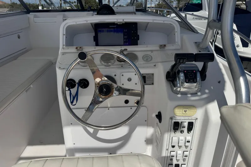 Slide: The Image of 2001 Pro-Line 30 Express boat helm with steering wheel and control panel. - 6