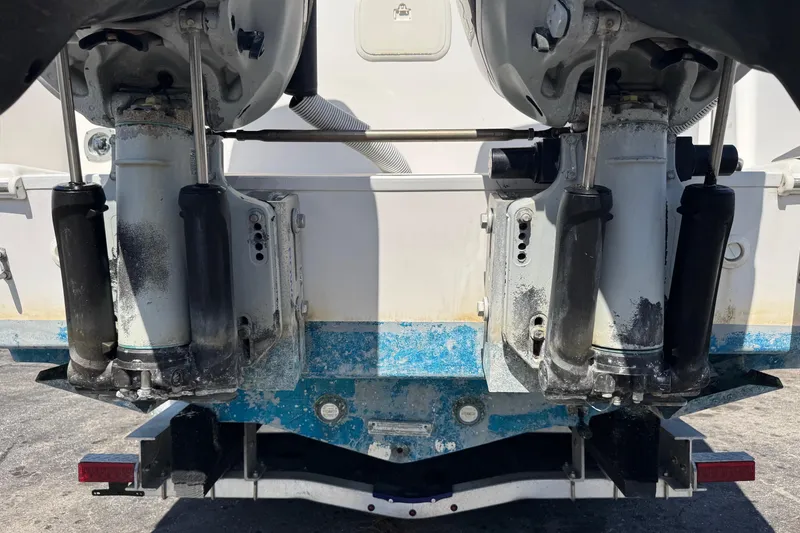 Slide: The Image of Rear view of 2001 Pro-Line 30 Express boat engines with visible wear. - 61