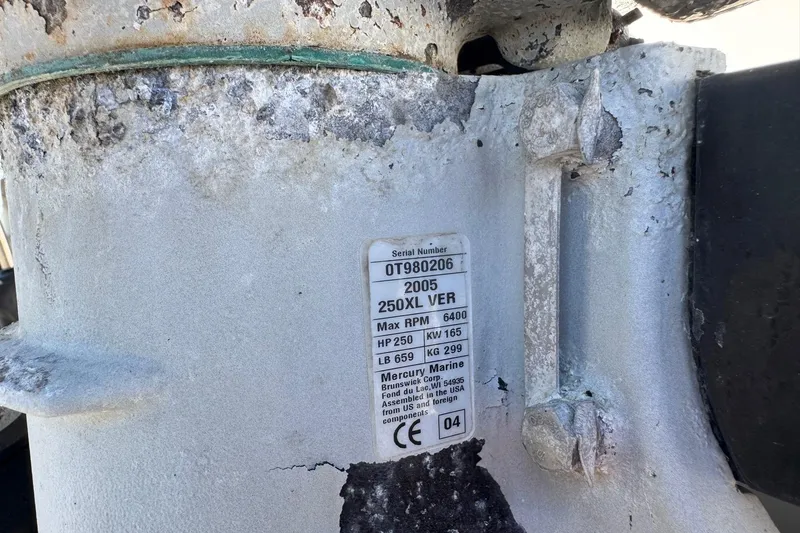 Slide: The Image of Weathered Mercury Marine engine label on a 2001 Pro-Line 30 Express boat. - 62