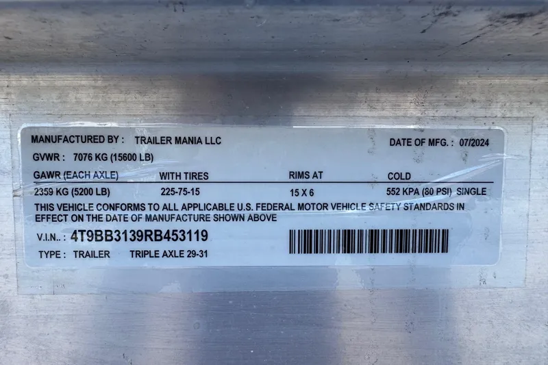 Slide: The Image of Label on a trailer by Trailer Mania LLC, manufactured 07/2024, with specifications and VIN. - 64