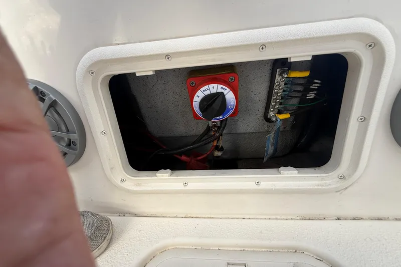 Slide: The Image of 2023 Carolina Skiff 21 LS battery switch and wiring compartment. - 14