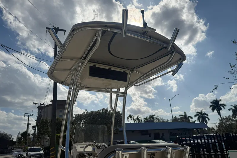Slide: The Image of 2023 Carolina Skiff 21 LS boat with T-top under a partly cloudy sky. - 16