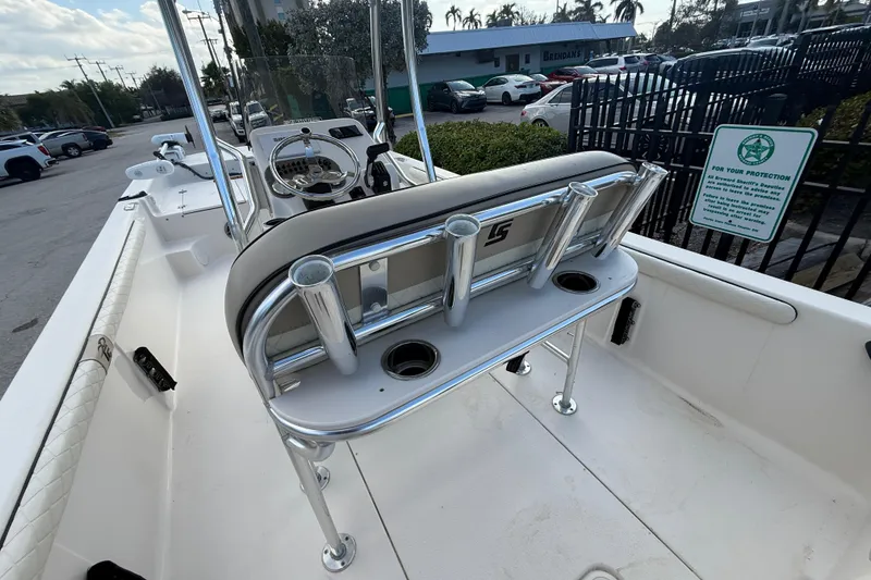 Slide: The Image of 2023 Carolina Skiff 21 LS boat interior with rod holders and steering console. - 8