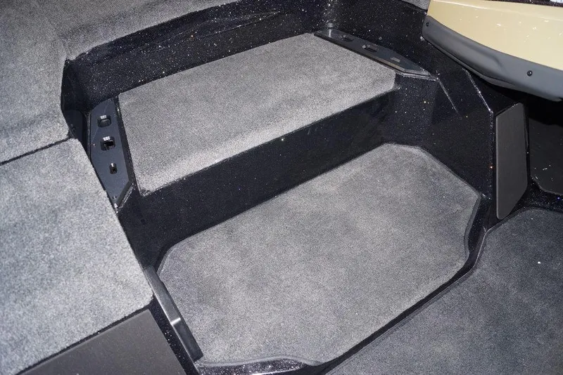 Slide: The Image of Interior of 2026 Skeeter ZXE21 boat with carpeted flooring and seating area. - 13
