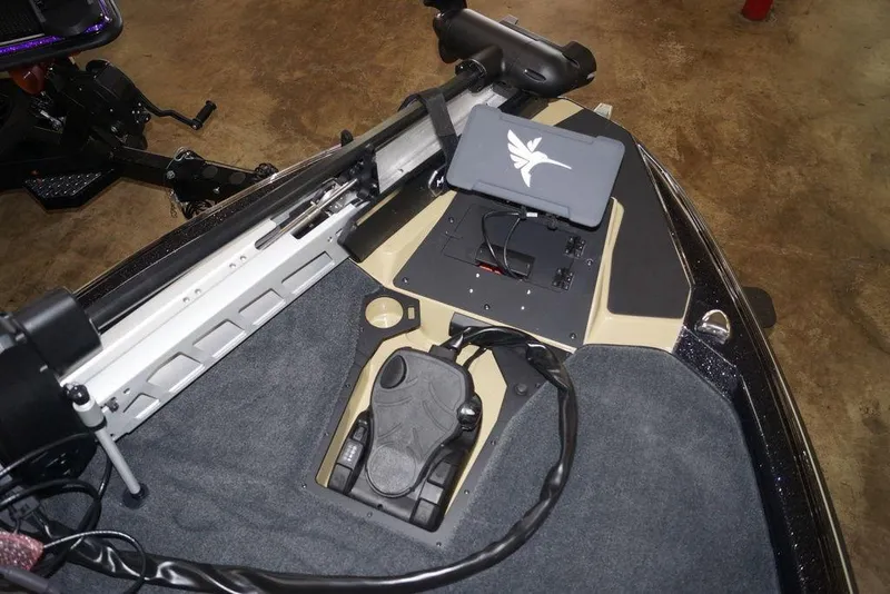 Slide: The Image of 2026 Skeeter ZXE21 boat interior with advanced control panel and foot pedal. - 21