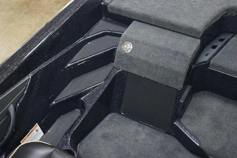 Slide: The Image of Interior of 2026 Skeeter ZXE21 boat with carpeted storage compartments. - 3