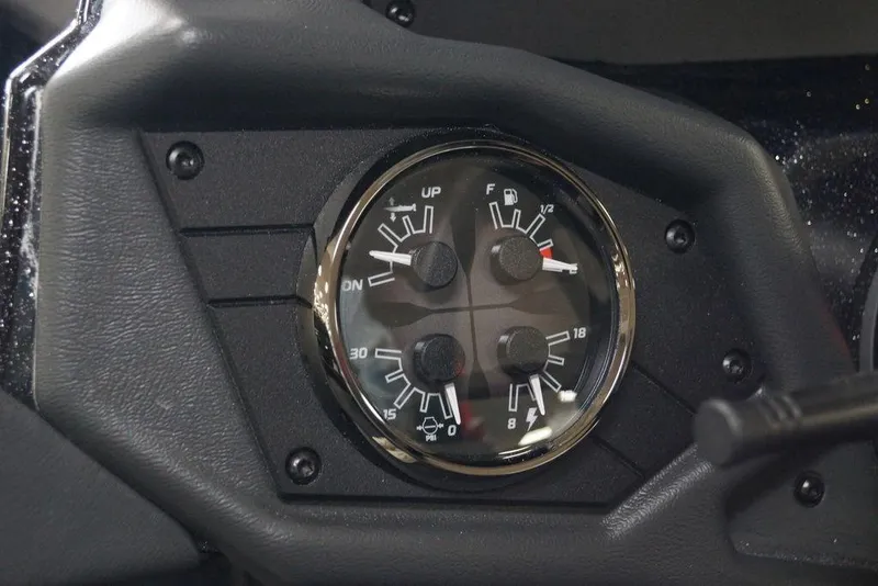 Slide: The Image of Dashboard gauges of 2026 Skeeter ZXE21 boat, showing fuel and pressure indicators. - 7