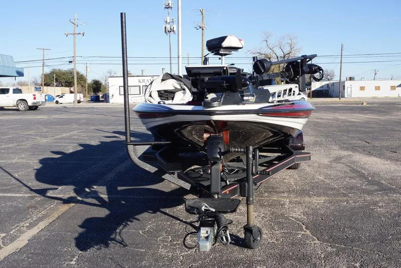 Slide: The Image of 2024 Skeeter FXR21 Limited boat on trailer in parking lot. - 17