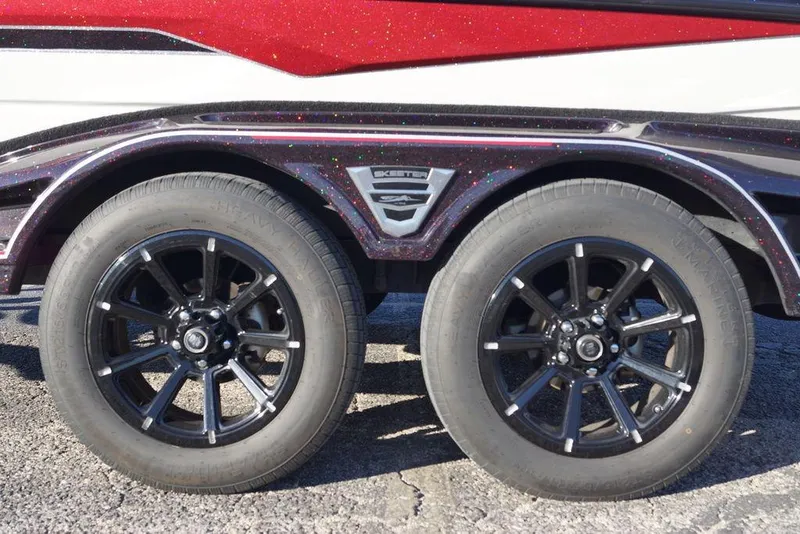 Slide: The Image of 2024 Skeeter FXR21 Limited trailer with black alloy wheels and glittery fender detailing. - 20