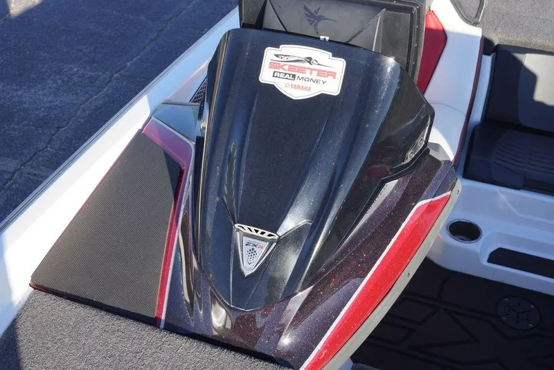 Slide: The Image of 2024 Skeeter FXR21 Limited boat deck with sleek black and red design. - 23