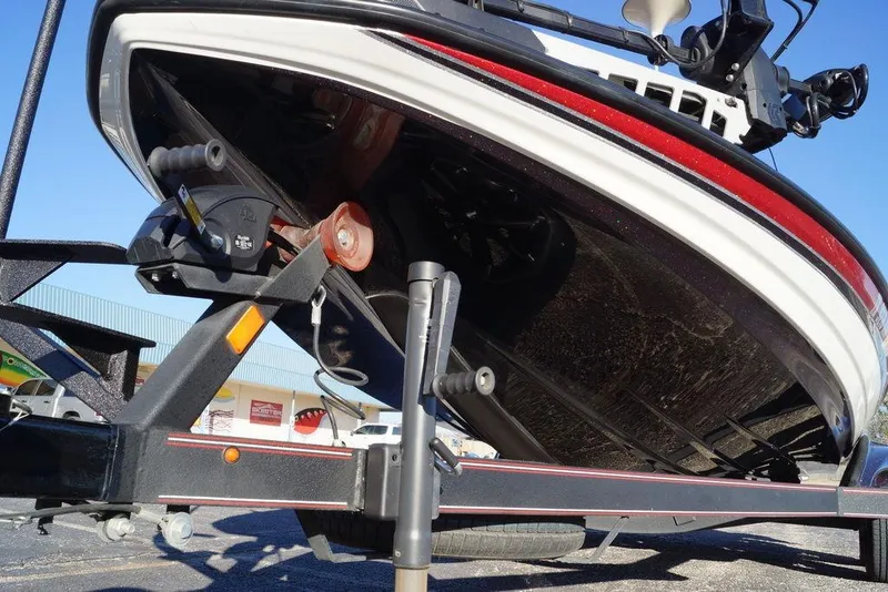 Slide: The Image of 2024 Skeeter FXR21 Limited boat on trailer, showcasing hull and trailer details. - 27