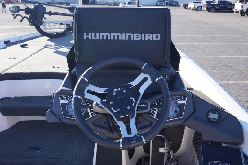 Slide: The Image of 2024 Skeeter FXR21 Limited boat dashboard with Humminbird display and steering wheel. - 32