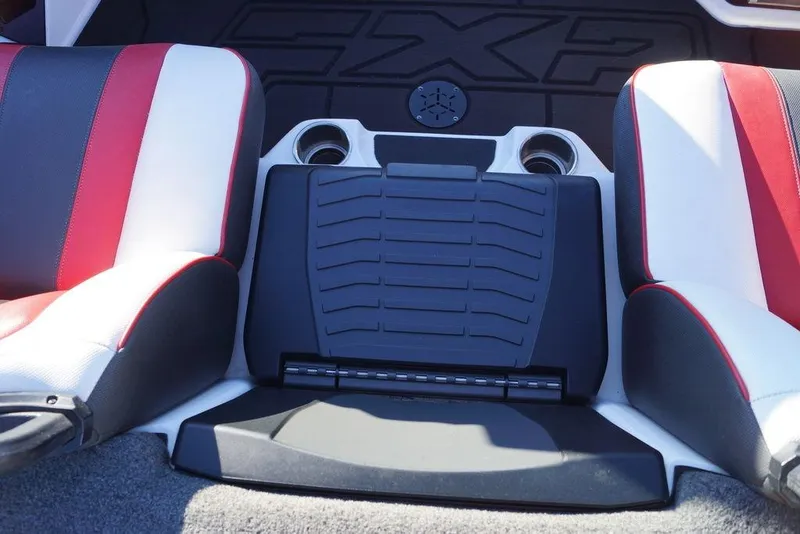 Slide: The Image of 2024 Skeeter FXR21 Limited boat interior with red and white seating and cup holders. - 4