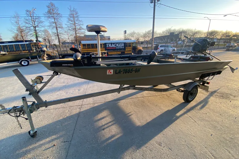 Slide: The Image of 2012 Alumacraft 1448 Jon boat on trailer, equipped with Minn Kota motor. - 7