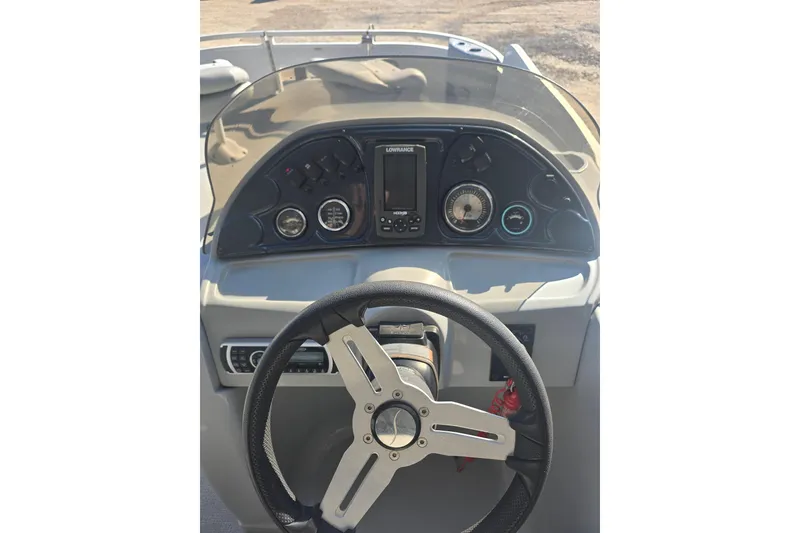 Slide: The Image of Steering console of 2017 SilverWave 230 Island boat with gauges and controls. - 10