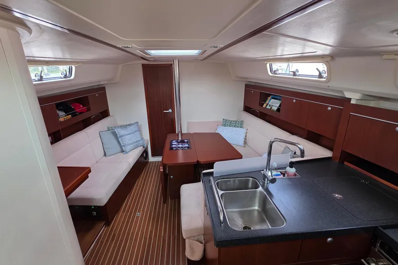 Slide: The Image of Interior of 2014 Hanse 385 yacht with modern kitchen and cozy seating area. - 24