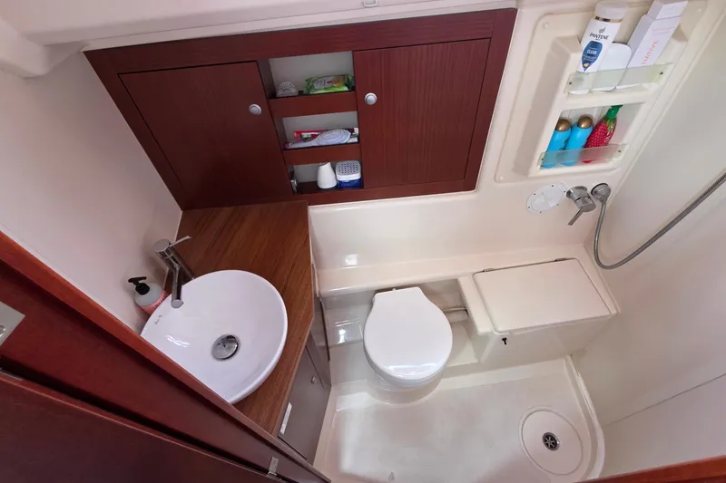 Slide: The Image of Compact bathroom in 2014 Hanse 385 yacht with sink, toilet, and shower amenities. - 25