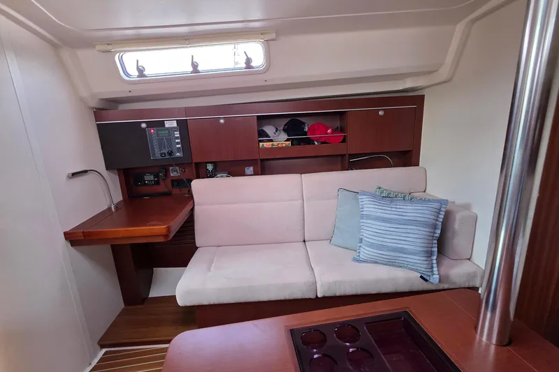 Slide: The Image of Interior of 2014 Hanse 385 yacht with cozy seating and wooden cabinetry. - 30