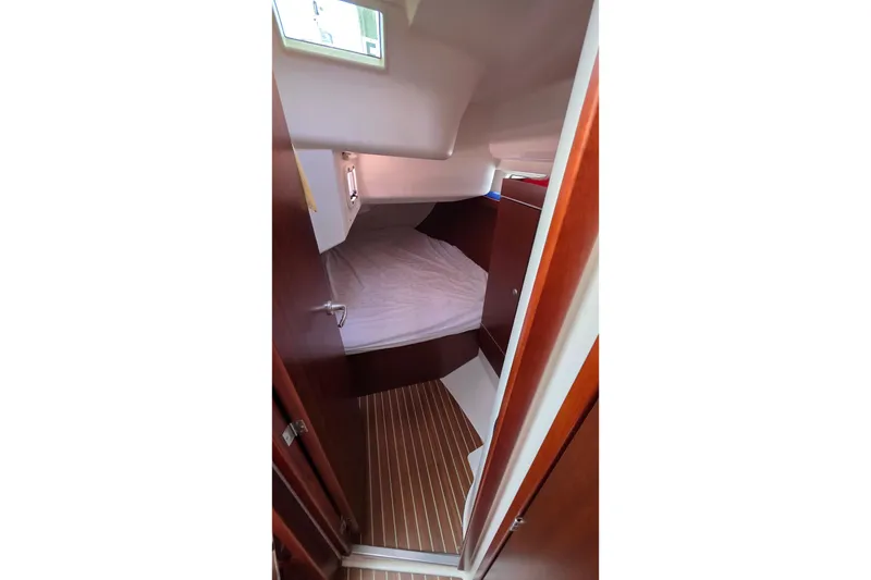 Slide: The Image of Cabin interior of 2014 Hanse 385 yacht with wooden finish and cozy bed. - 37