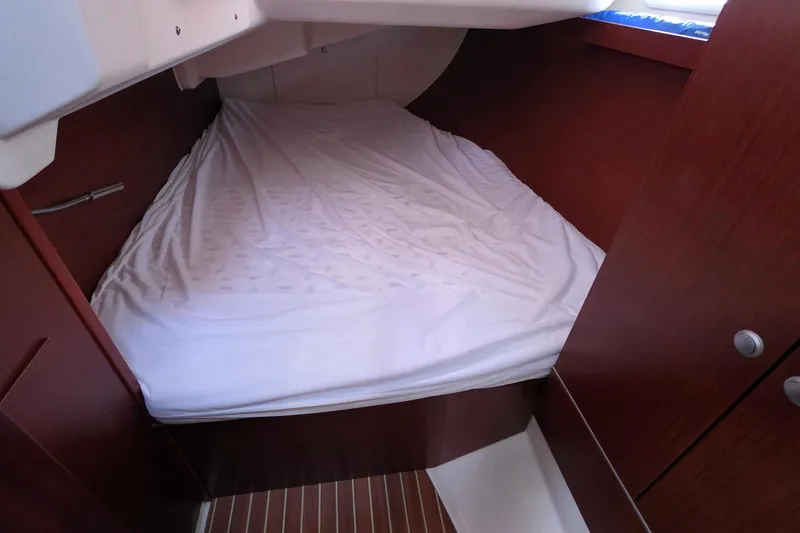 Slide: The Image of Cozy cabin interior of 2014 Hanse 385 yacht with wooden finish and comfortable bedding. - 38