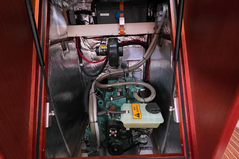 Slide: The Image of Engine compartment of a 2014 Hanse 385 sailboat, featuring insulated walls and visible wiring. - 40