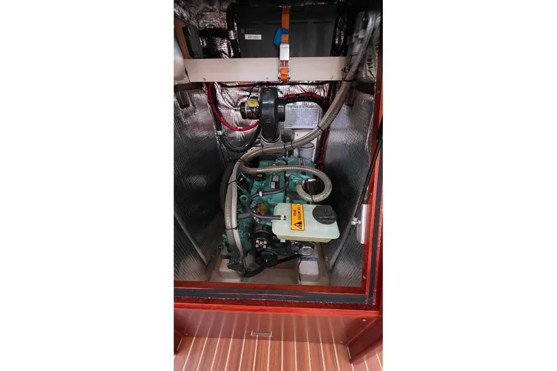 Slide: The Image of Engine compartment of a 2014 Hanse 385 sailboat, showcasing mechanical components. - 41