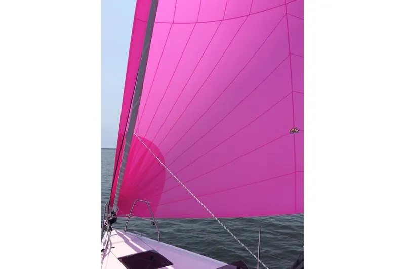 Slide: The Image of Pink sail on a 2014 Hanse 385 yacht against the sea. - 42