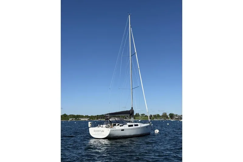 Slide: The Image of 2014 Hanse 385 sailboat on calm water under clear blue sky. - 43