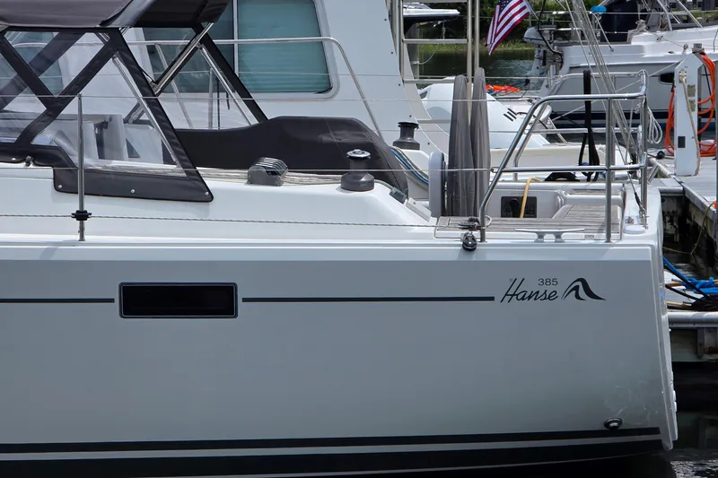 Slide: The Image of 2014 Hanse 385 yacht docked at marina, featuring sleek design and modern amenities. - 5