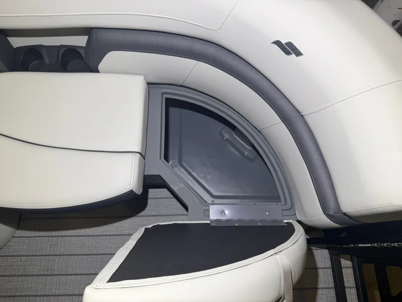 Slide: The Image of The image shows a sleek, cushioned seating area with integrated storage on a boat. - 17