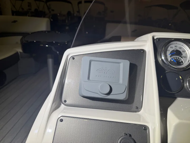 Slide: The Image of The image shows the dashboard of a Starcraft EX 20 Q DH boat with a volume control. - 28