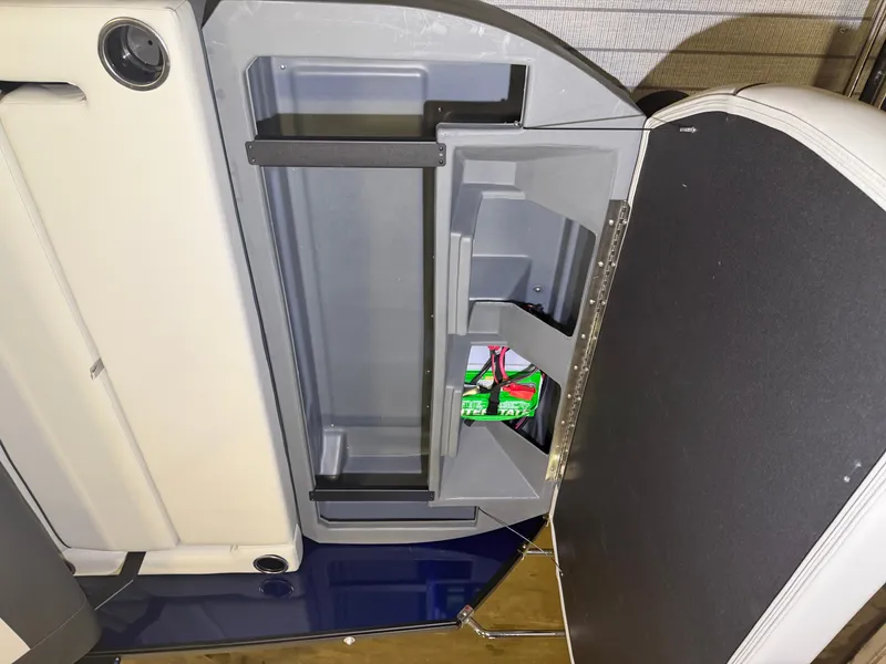 Slide: The Image of An open storage compartment with shelves and a life ring inside. - 40