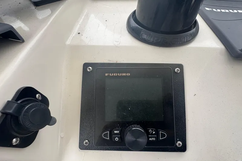 Slide: The Image of Furuno navigation system on 2002 Hampton 550 boat dashboard. - 17