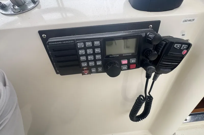 Slide: The Image of Marine radio system on a 2002 Hampton 550 yacht dashboard. - 21