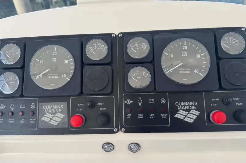 Slide: The Image of Control panel of a 2002 Hampton 550 with Cummins Marine gauges and indicators. - 22