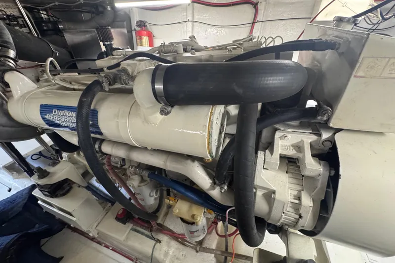 Slide: The Image of Engine room of a 2002 Hampton 550 yacht, featuring a Diamond Performance Series engine. - 31