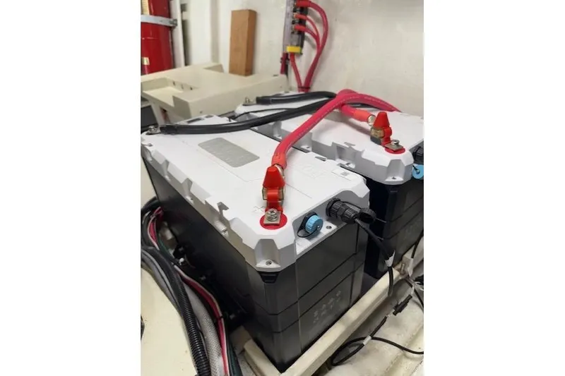 Slide: The Image of Battery setup in a 2002 Hampton 550 yacht engine room. - 50
