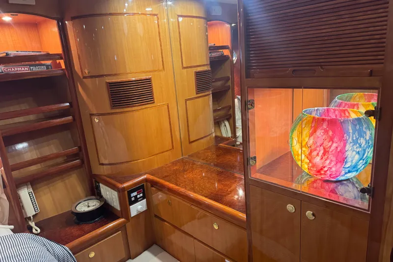 Slide: The Image of Luxurious wooden interior of a 2002 Hampton 550 yacht with colorful glass decor. - 69
