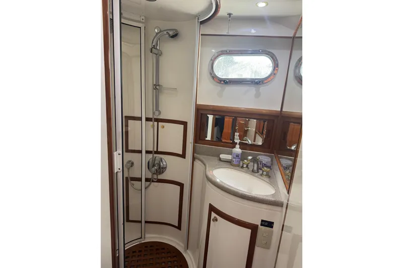 Slide: The Image of Luxurious bathroom in 2002 Hampton 550 yacht with shower and sink. - 75