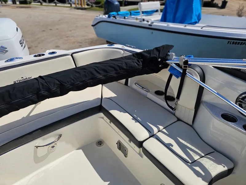 Slide: The Image of Interior of a 2022 Stingray 231 DC boat with seating area. - 10