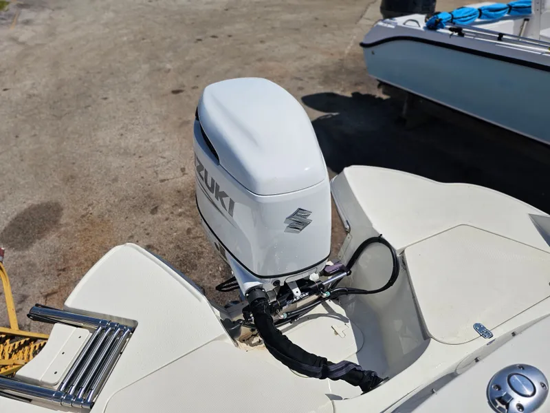 Slide: The Image of Suzuki outboard motor on a 2022 Stingray 231 DC boat. - 11