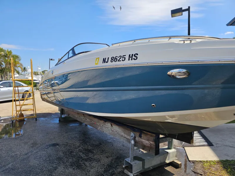 Slide: The Image of 2022 Stingray 231 DC boat on a dry dock. - 2
